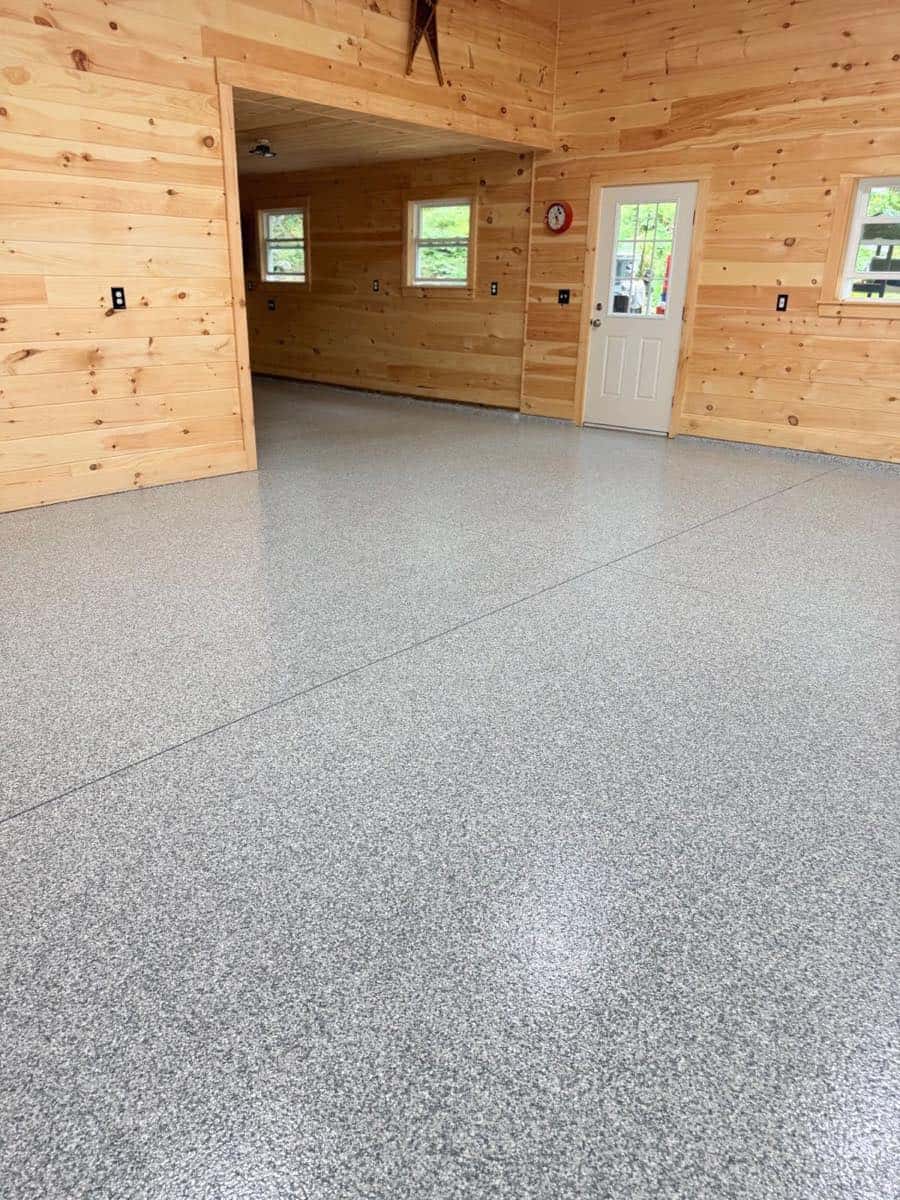 Lakeside camp garage with a gray flake epoxy floor