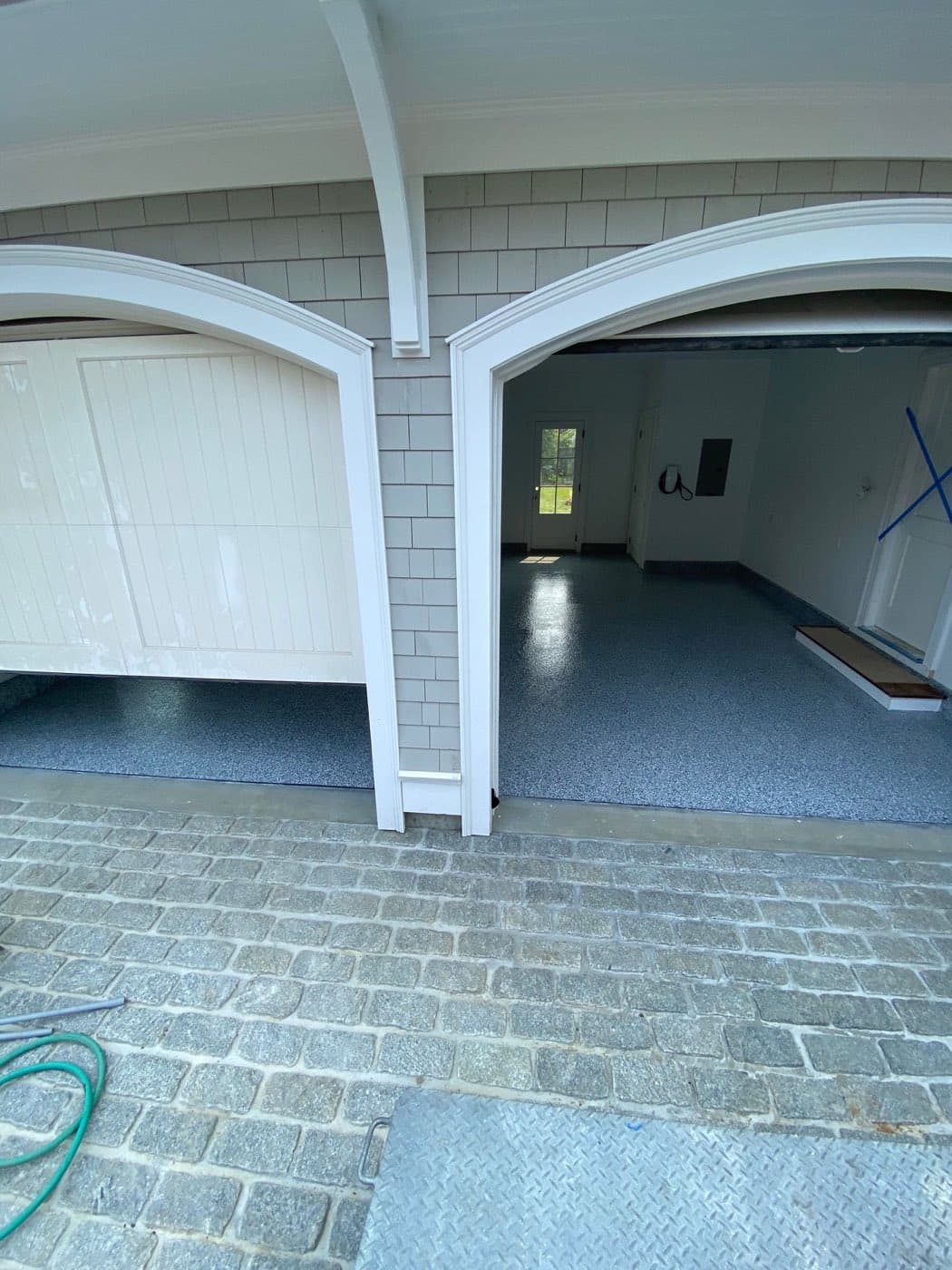 Carriage house garage bay with flake floor