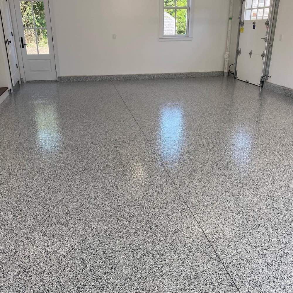 Garage bay with flake epoxy to the door line