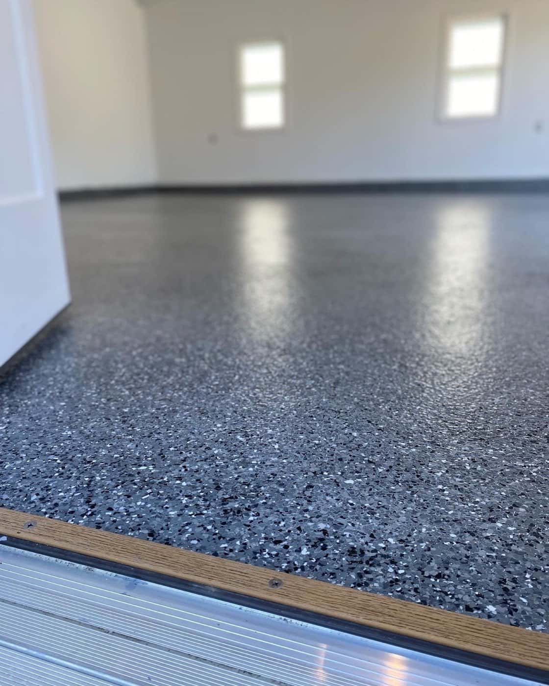 Open garage bay with a finished flake epoxy floor