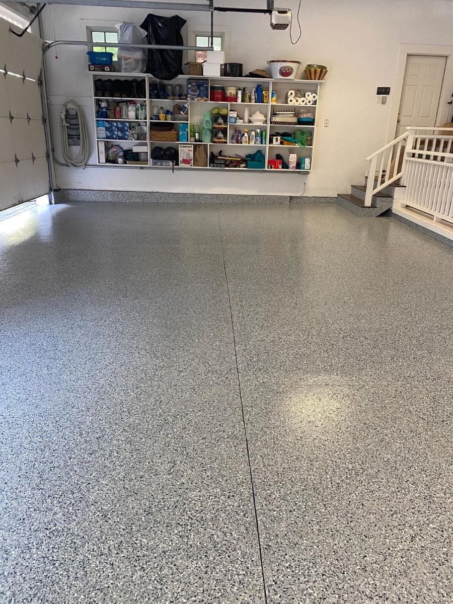 Organized garage with flake epoxy floor and shelving