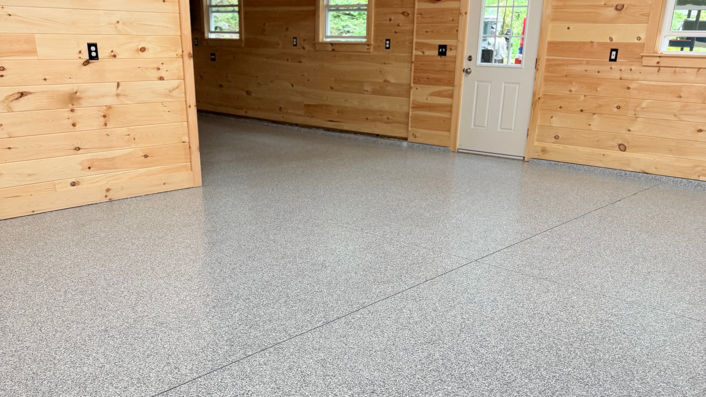Full-flake epoxy garage floor installed by Southern Maine Epoxy