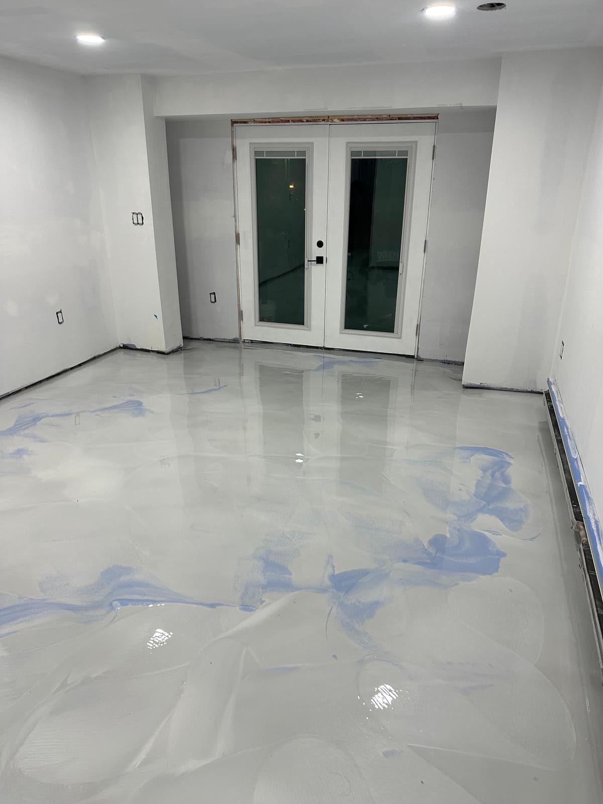 Pearl metallic epoxy floor by French doors